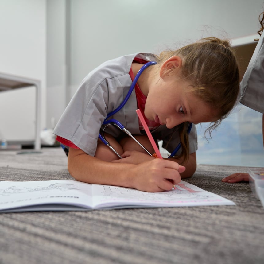 Girl Coloring In Book